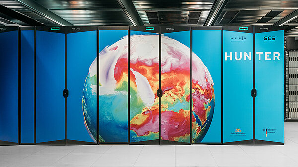 Frontal View of HLRS's Hunter supercomputer, showing image of Earth weather simulation. Copyright: Julian Holzwarth/HLRS